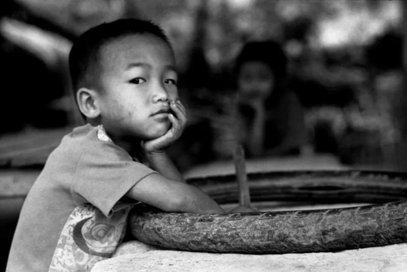 potrait of akha kid with tyre
