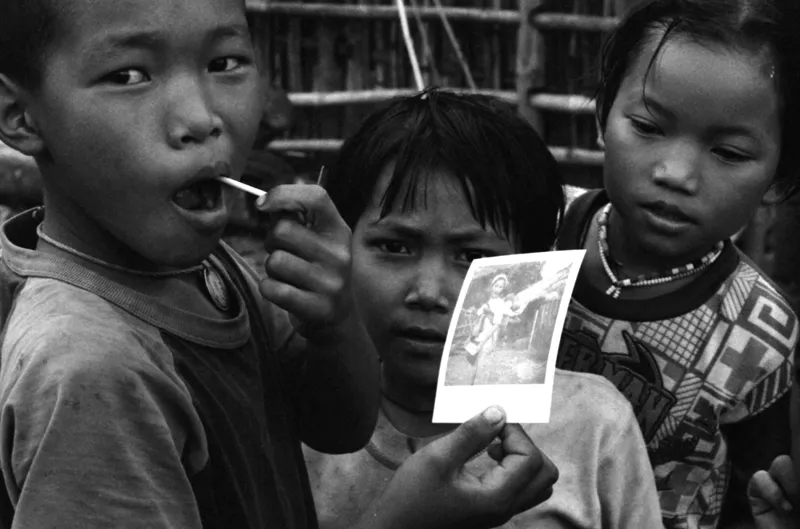 akha kids with polaroid photo