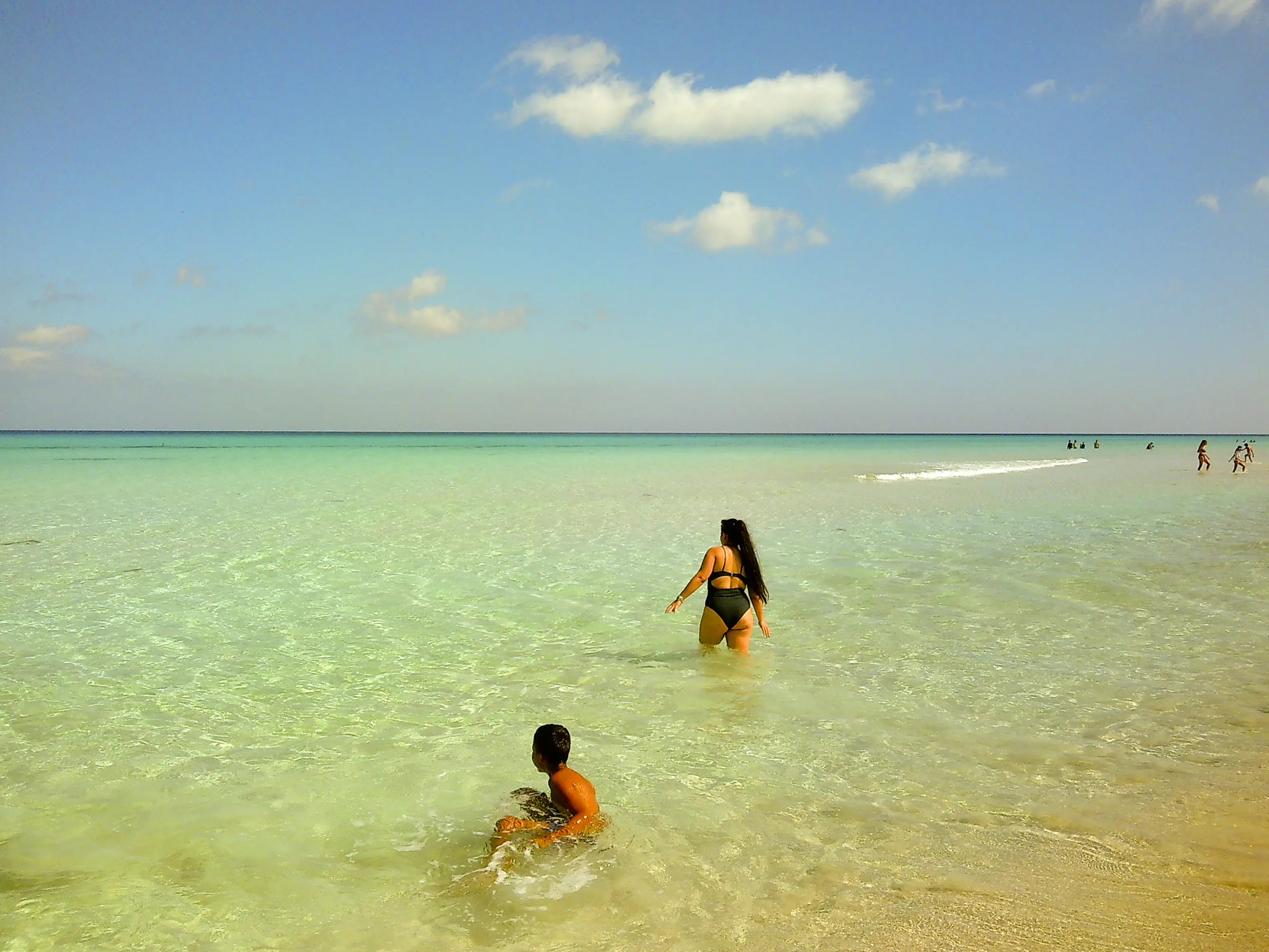 mother and son in the sea