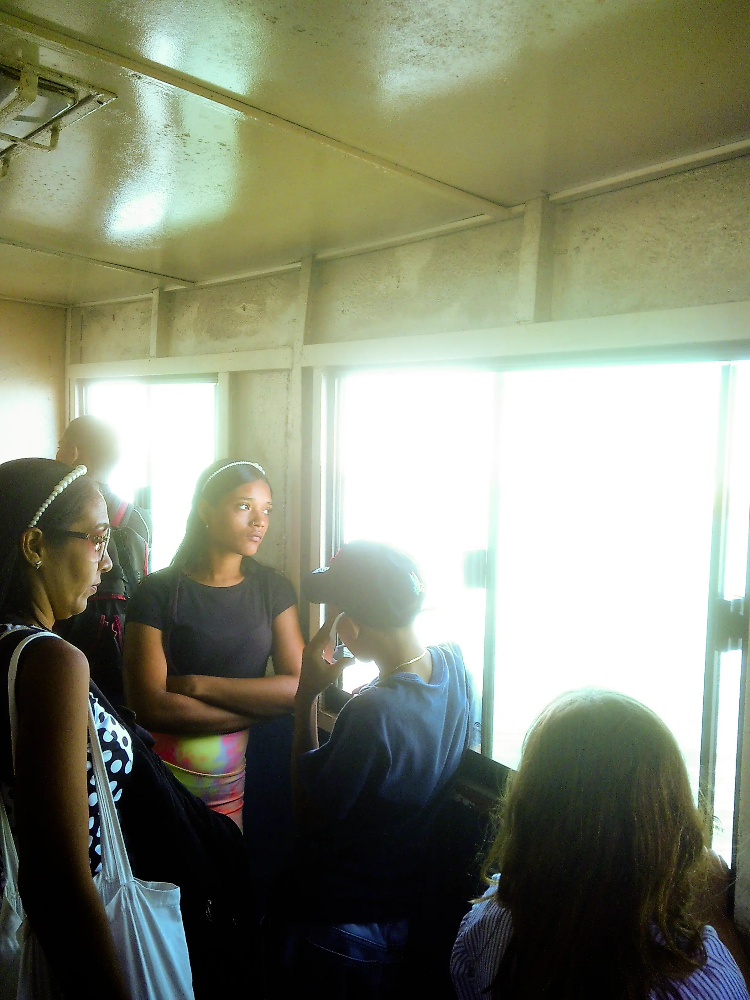 young woman looking outside the ferry window