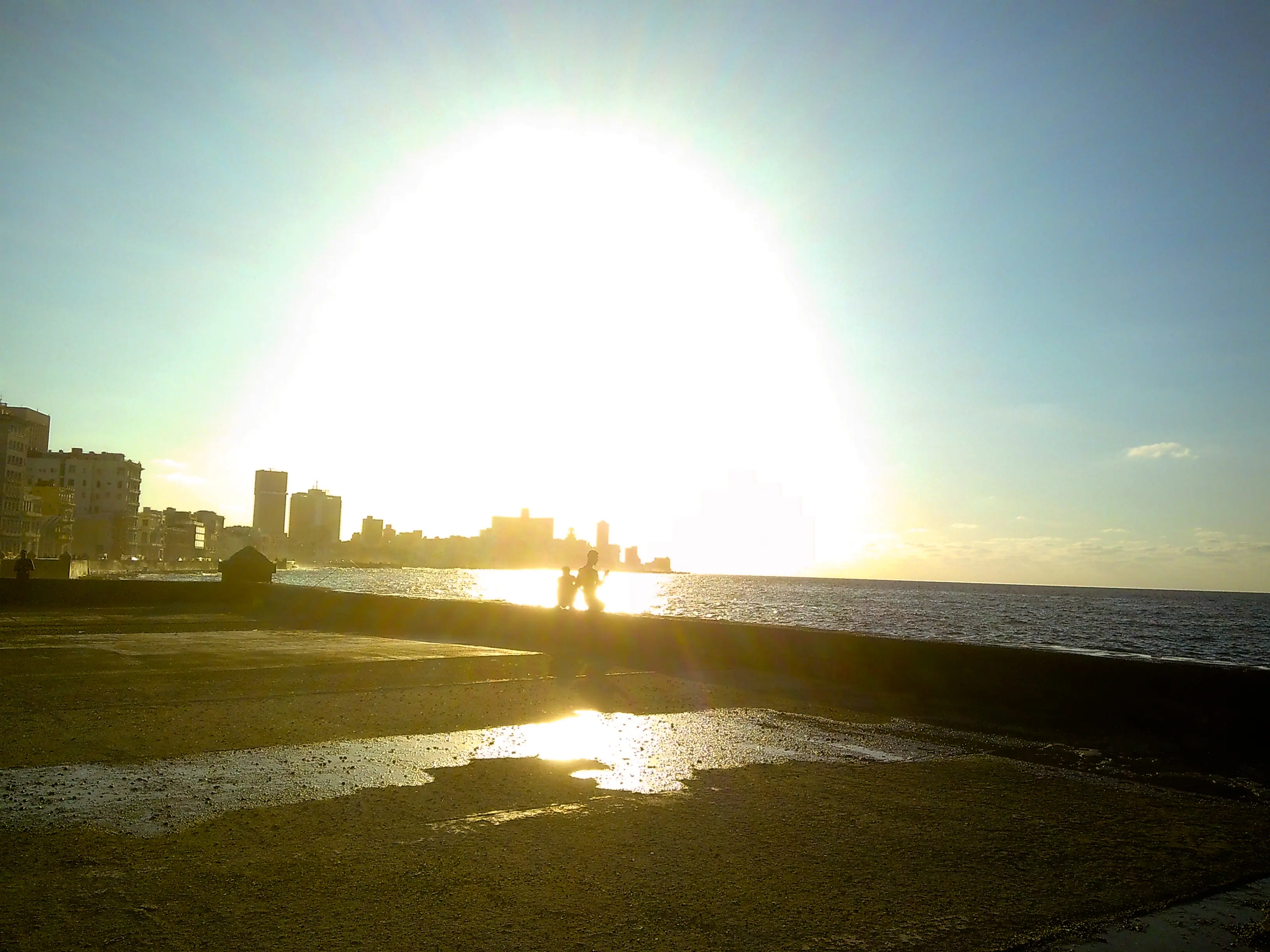lads playing in the sun at dusk on Malecon