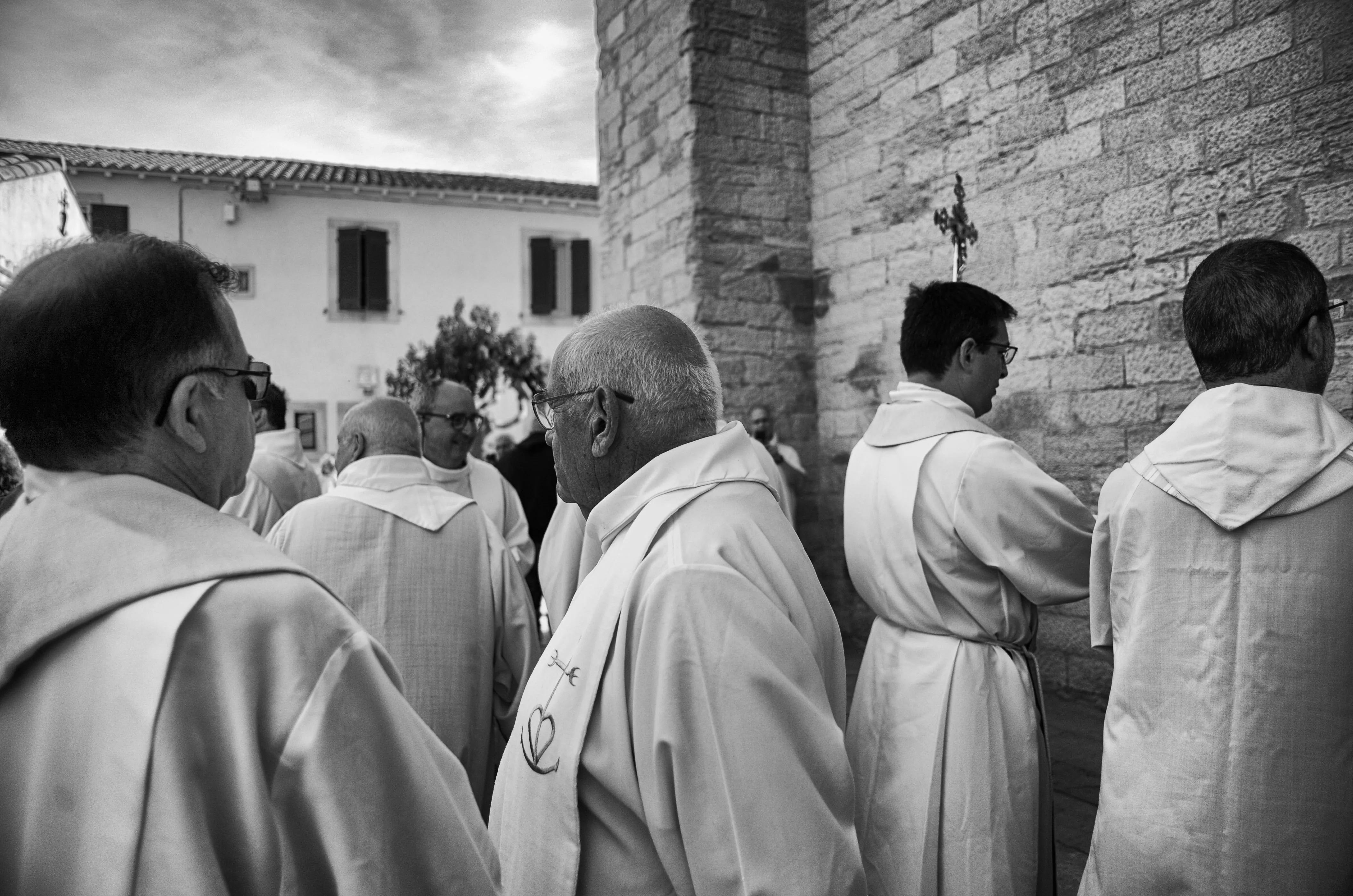 priests waiting before the procession begins