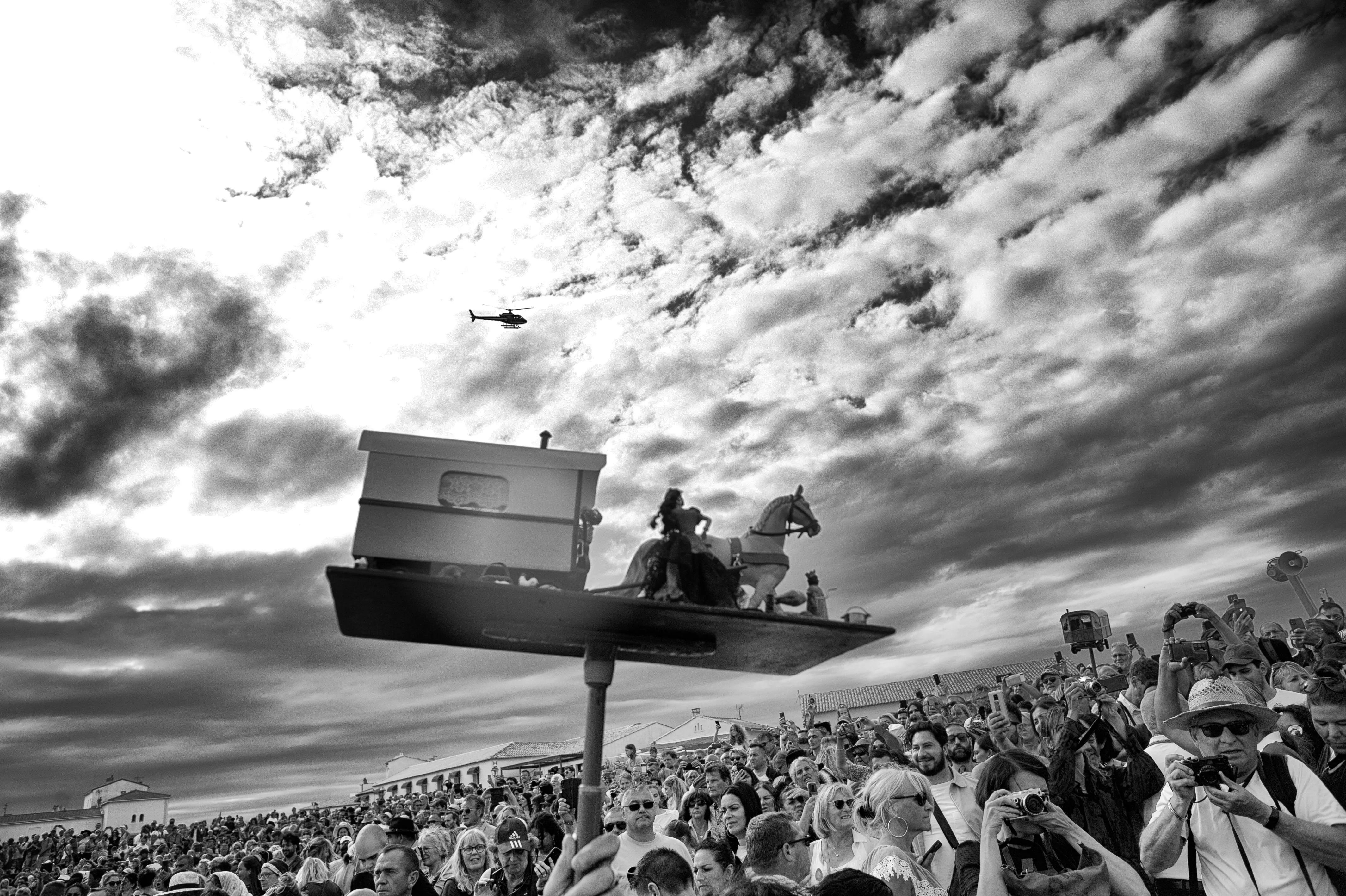 a miniature of Santa Sara is brought by the crowd