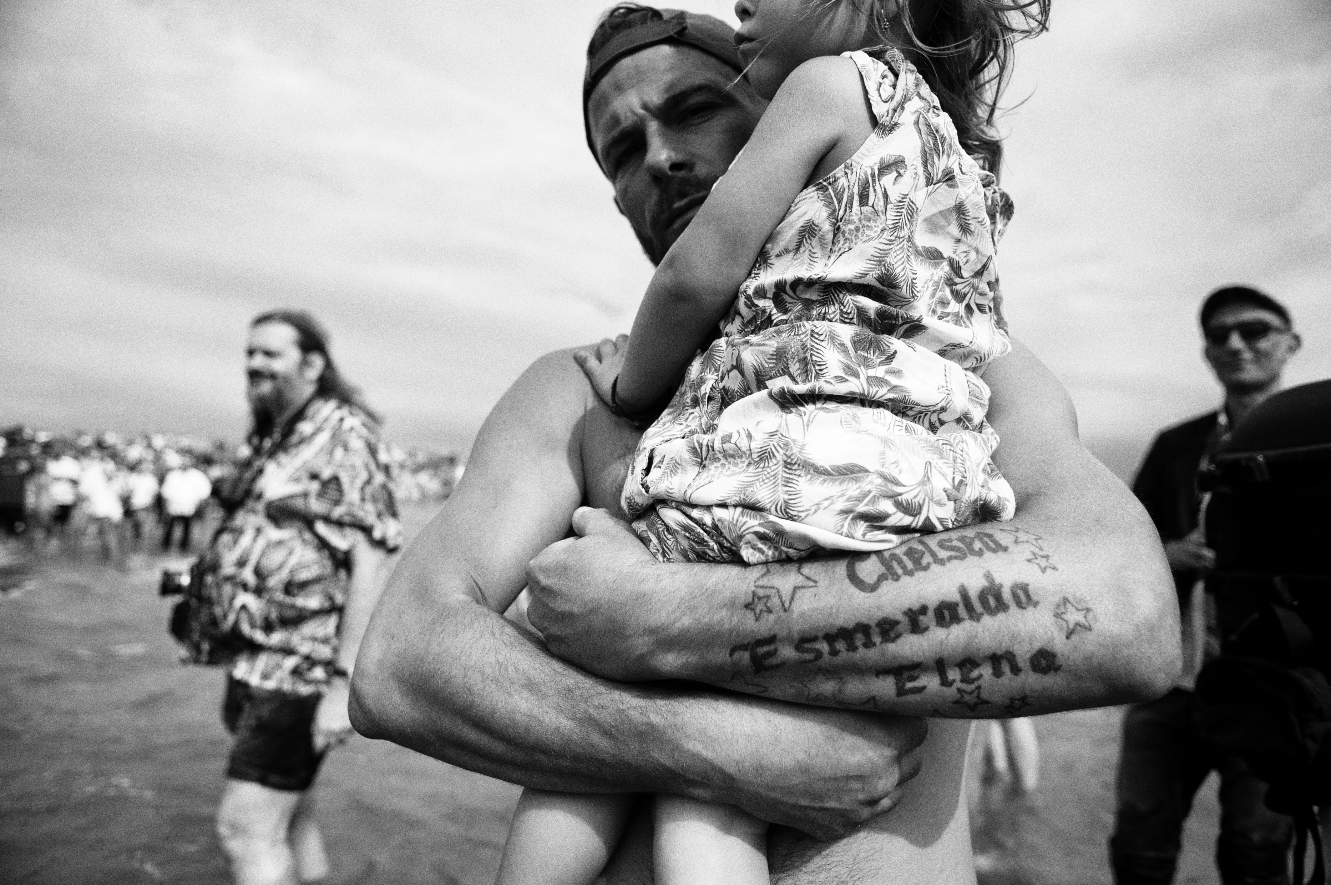 man with kid in the sea