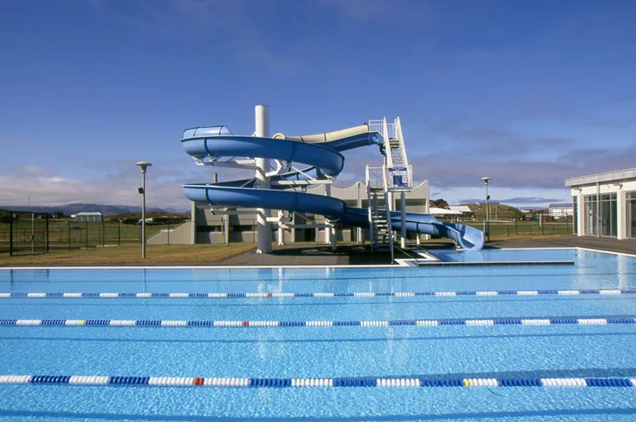 slide in front of blue swimming pool