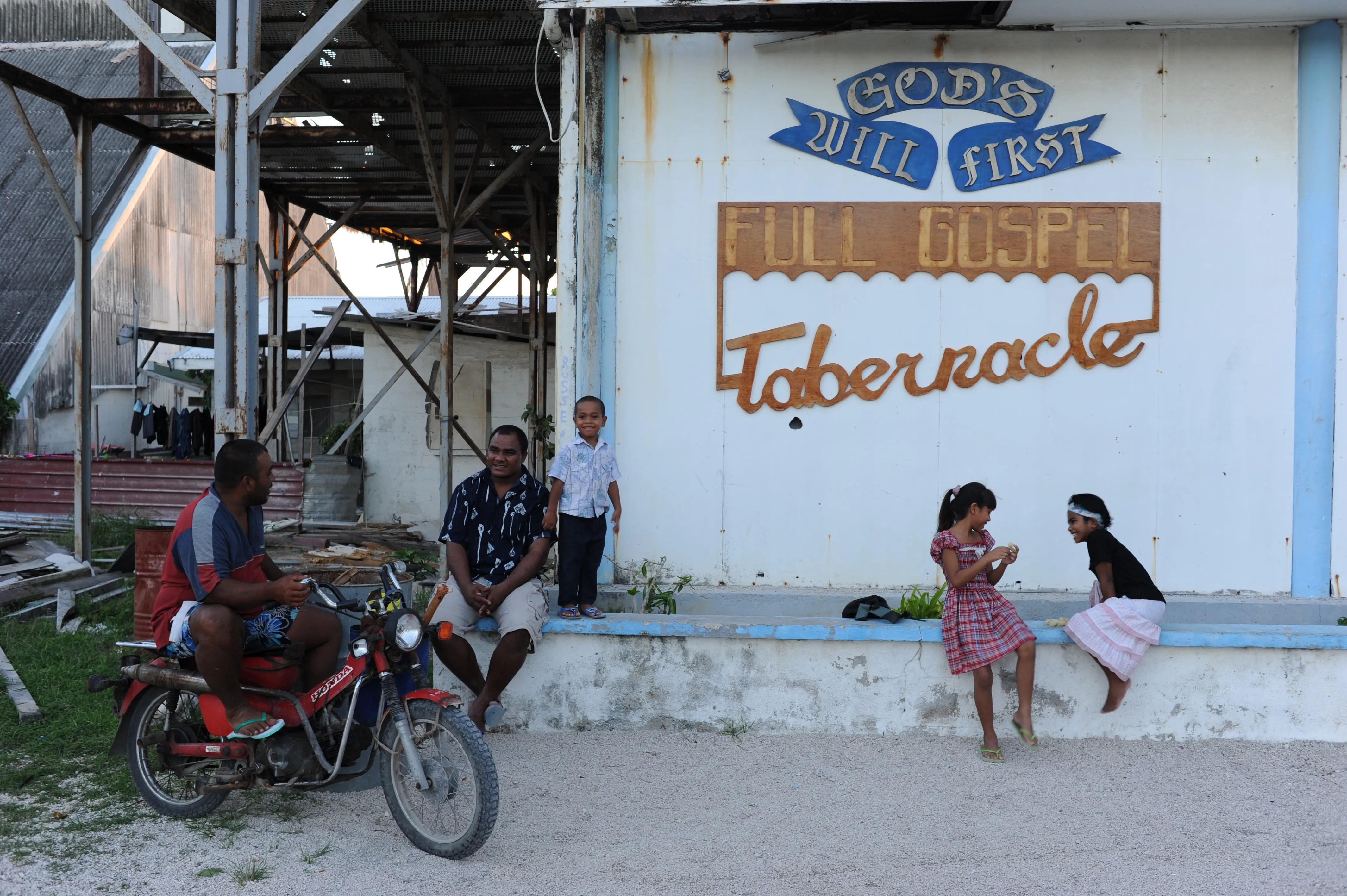 girls talk next to motos