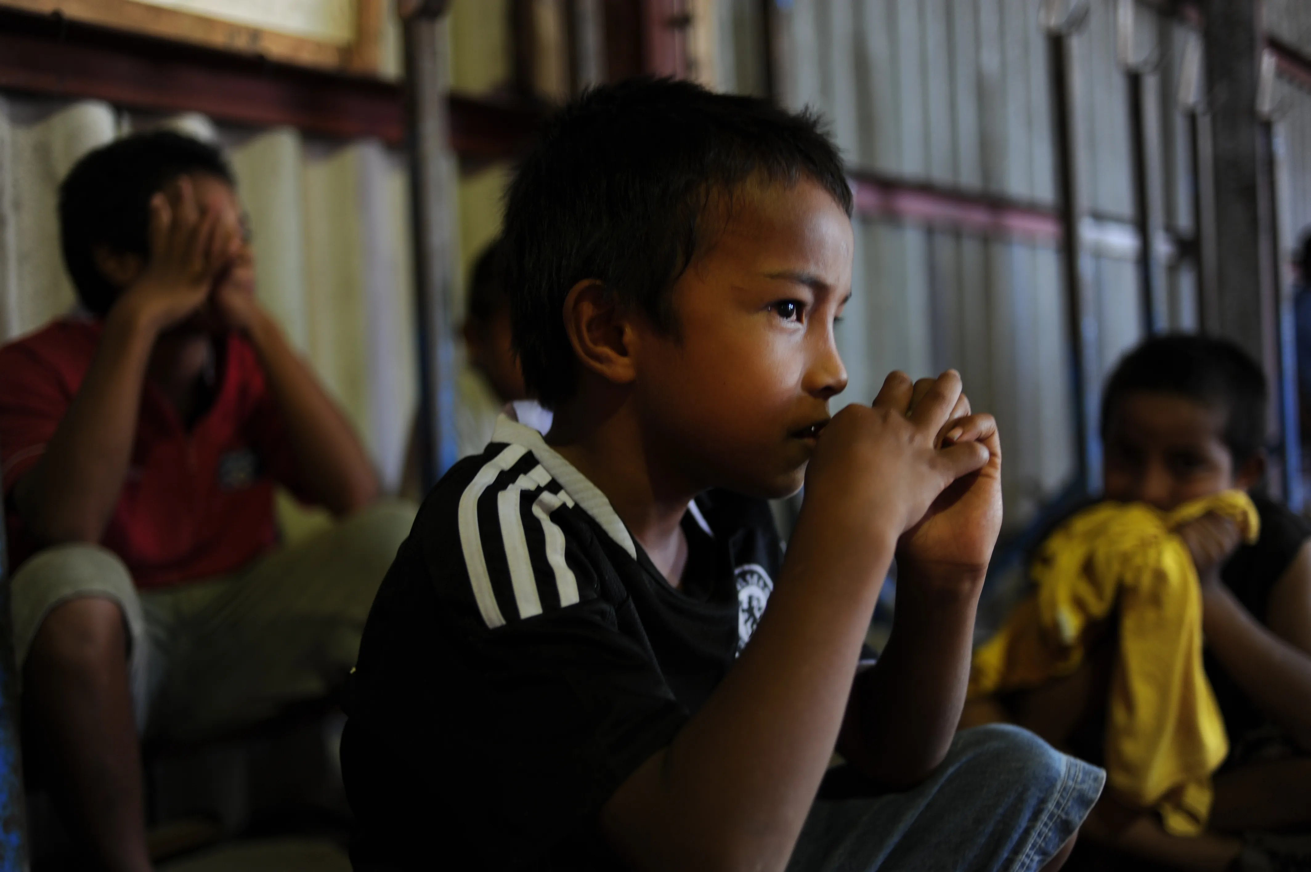 kid watches weightlifting in nauru