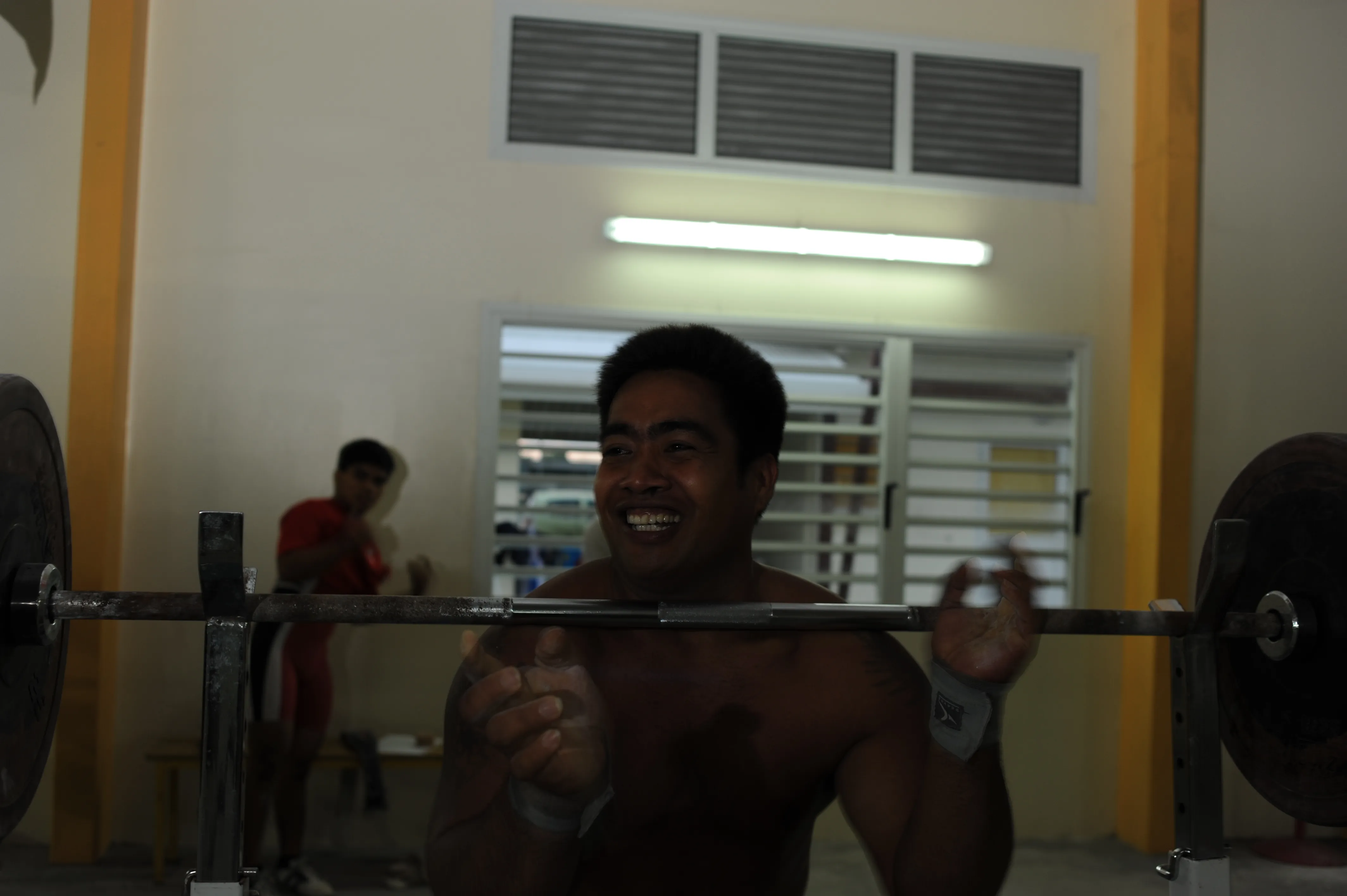 David laughs while weightlifting