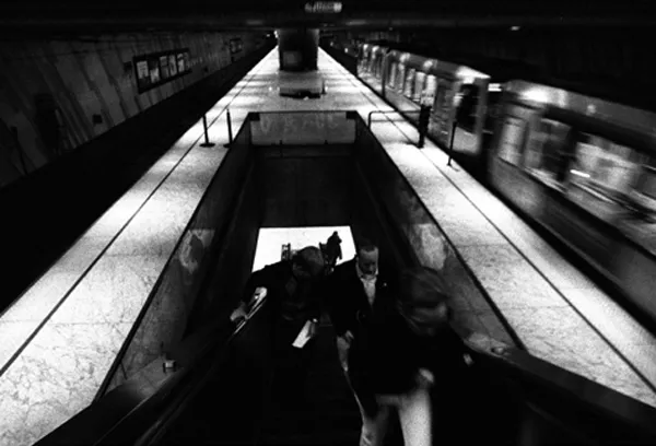 commuters climb stairs to the trains