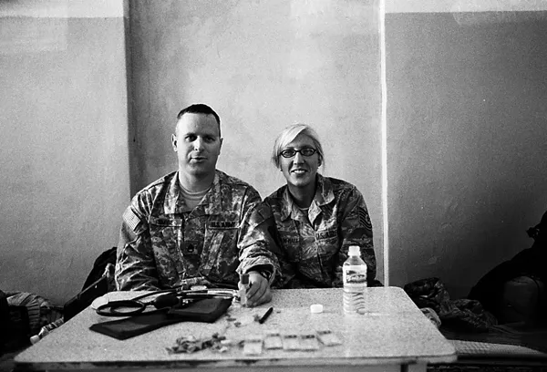 two soldiers at the military aid distribution