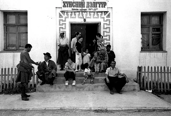 mongolian crowd in front of entrance door of building