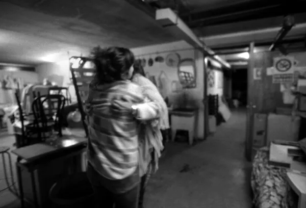 friends hug in social centre