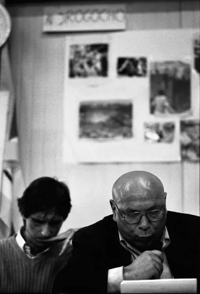 mimmo man speaks at a book presentation