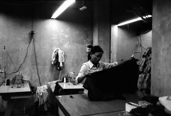 woman with dress at the sewer